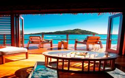 View from an overwater bungalow bed at Likuliku