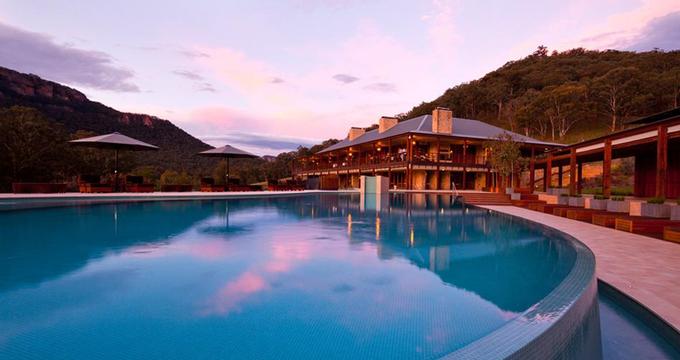 Emirates Wolgan Valley Resort  main pool at sunset